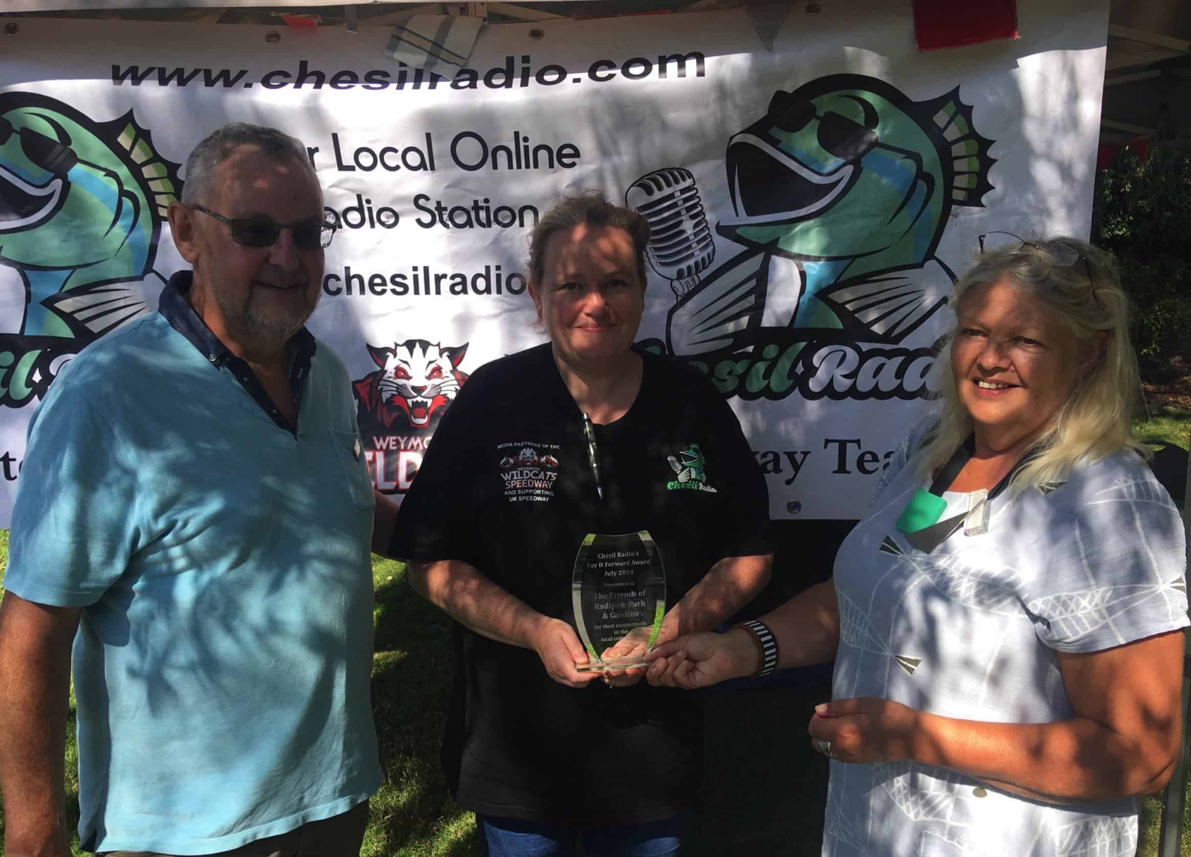 Chesil radiop presenting Pay it Forward award to the Friends of Radipole park and gardens 2019